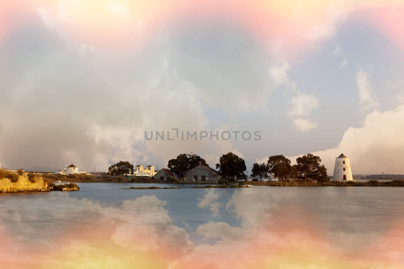 Portuguese tidemill during a cold and colorful sunset at a Tejo river.