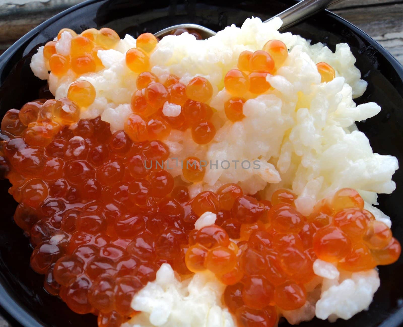 Rice with red caviar in black chalice by Julialine