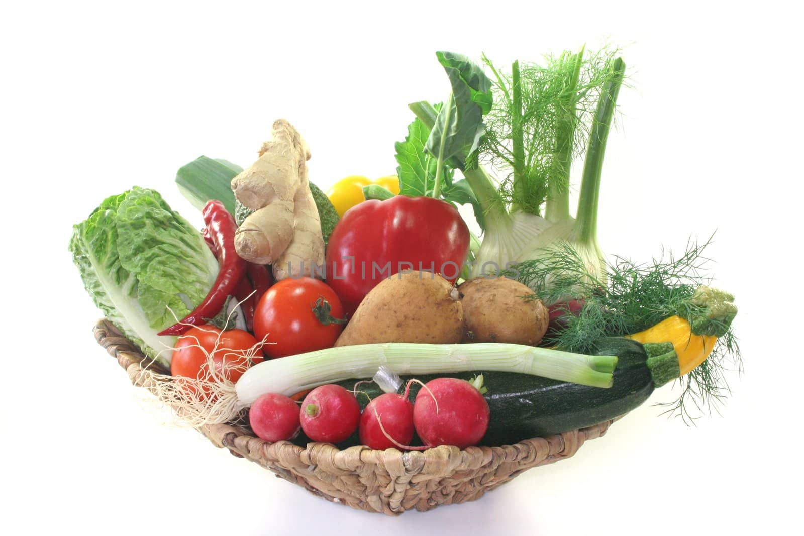 Colorful mixture of many different fresh vegetables in a basket