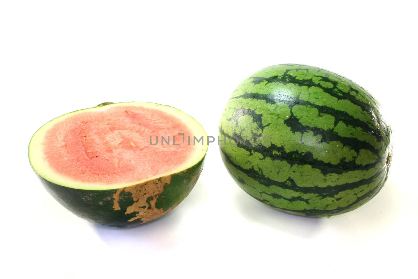 Watermelon cut in half on a white background