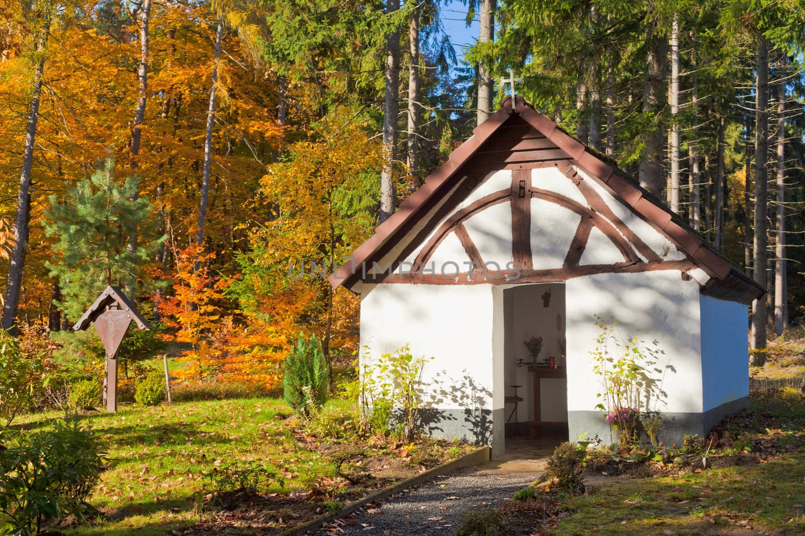 Historic chapel (from 1823) in beautiful fall forest of Eifel region, rural Germany.