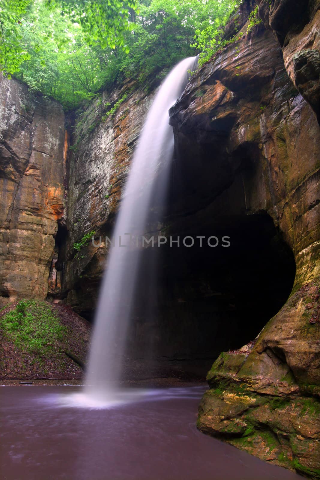 Surging waterfall crashes into Tonti Canyon on a spring day at Starved Rock State Park.