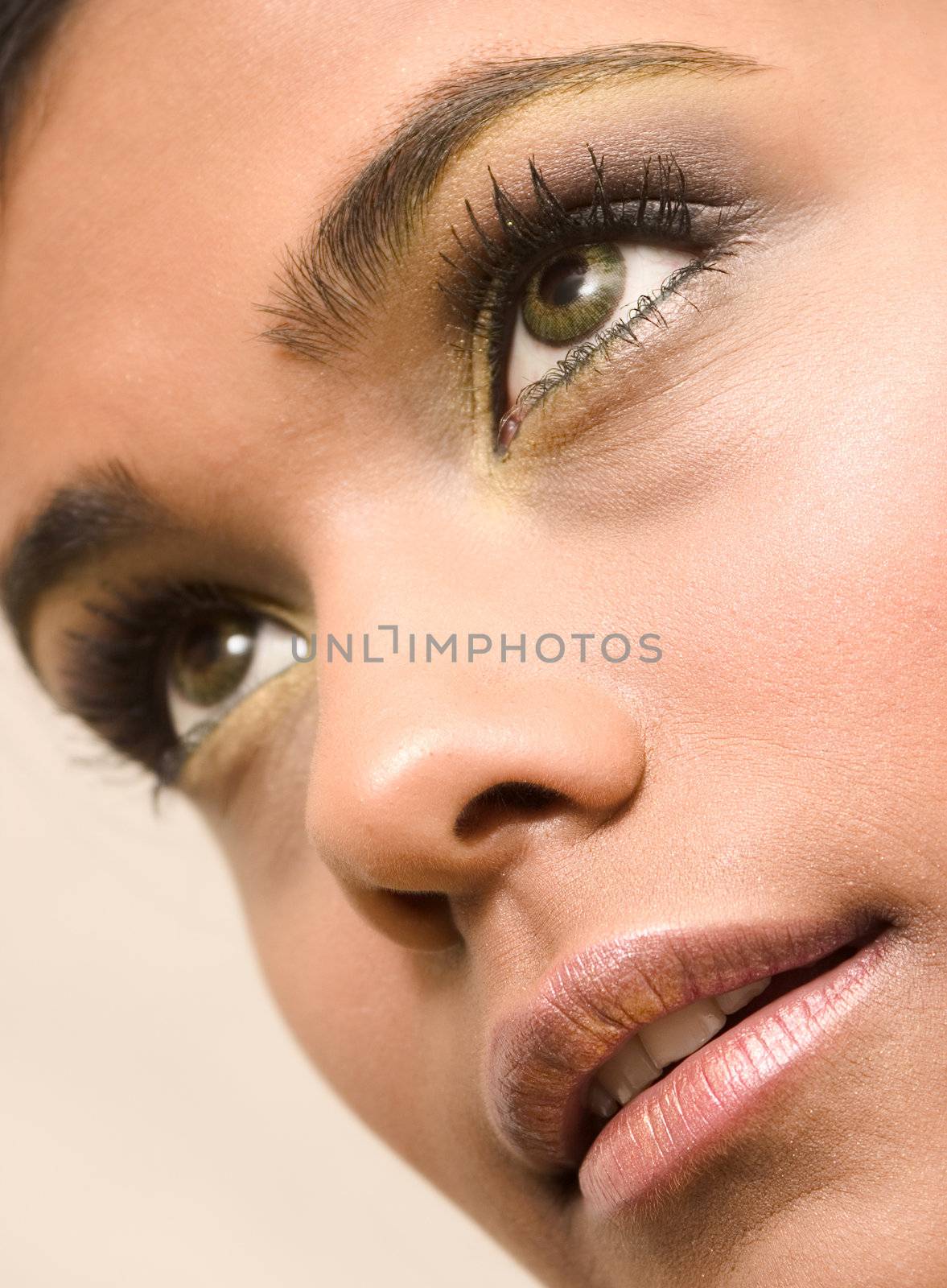 Studio portrait of an Indian  Indonesian beauty model  looking down