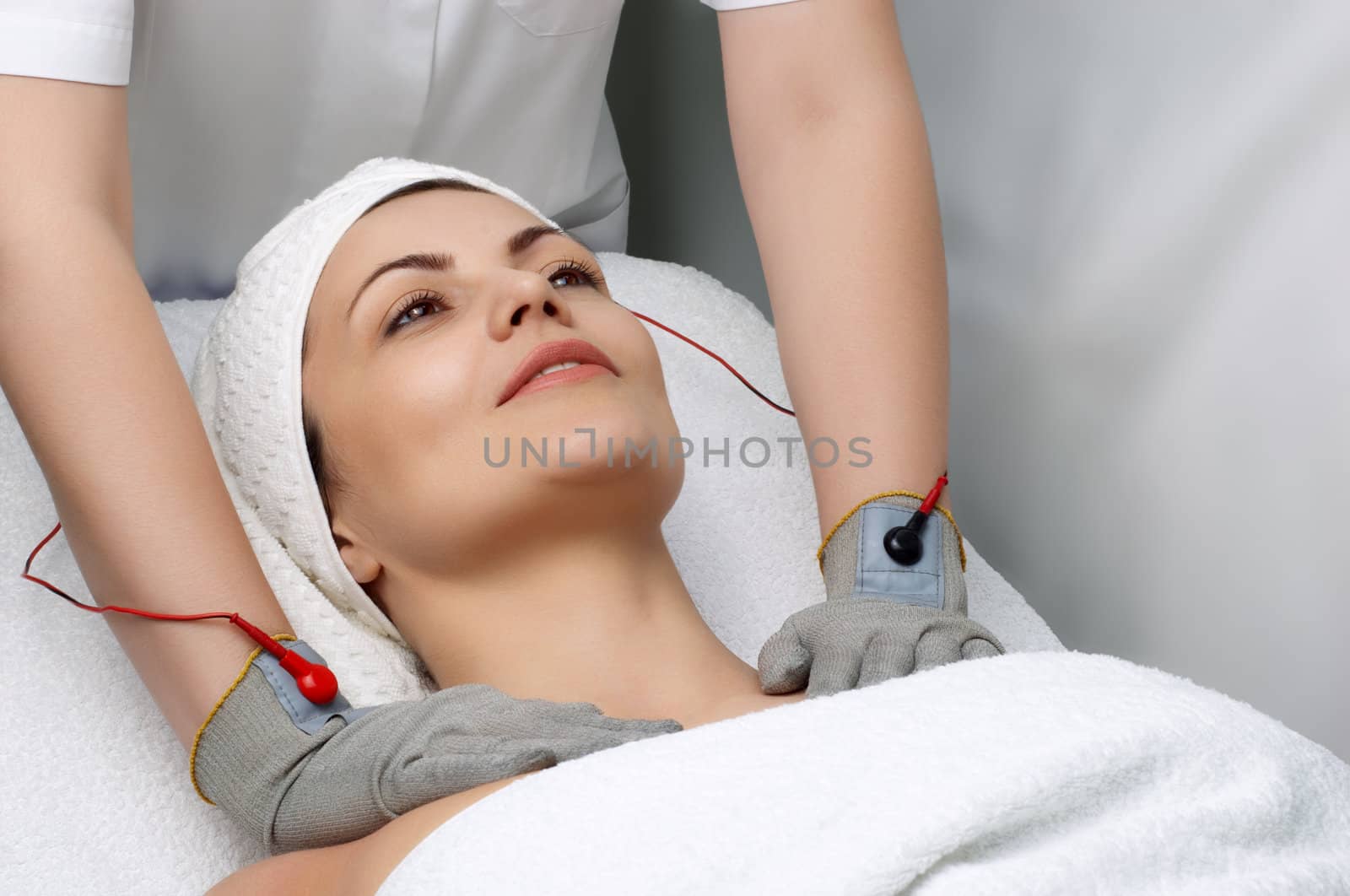 woman getting special electric massage in the beauty salon