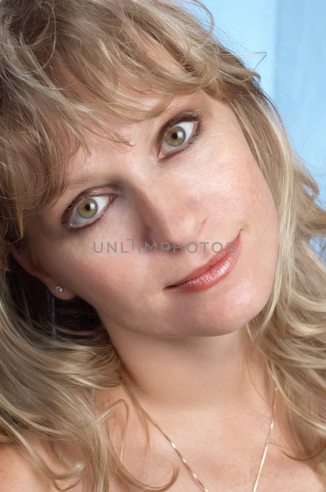 young blond woman facal portrait, expressing positivity