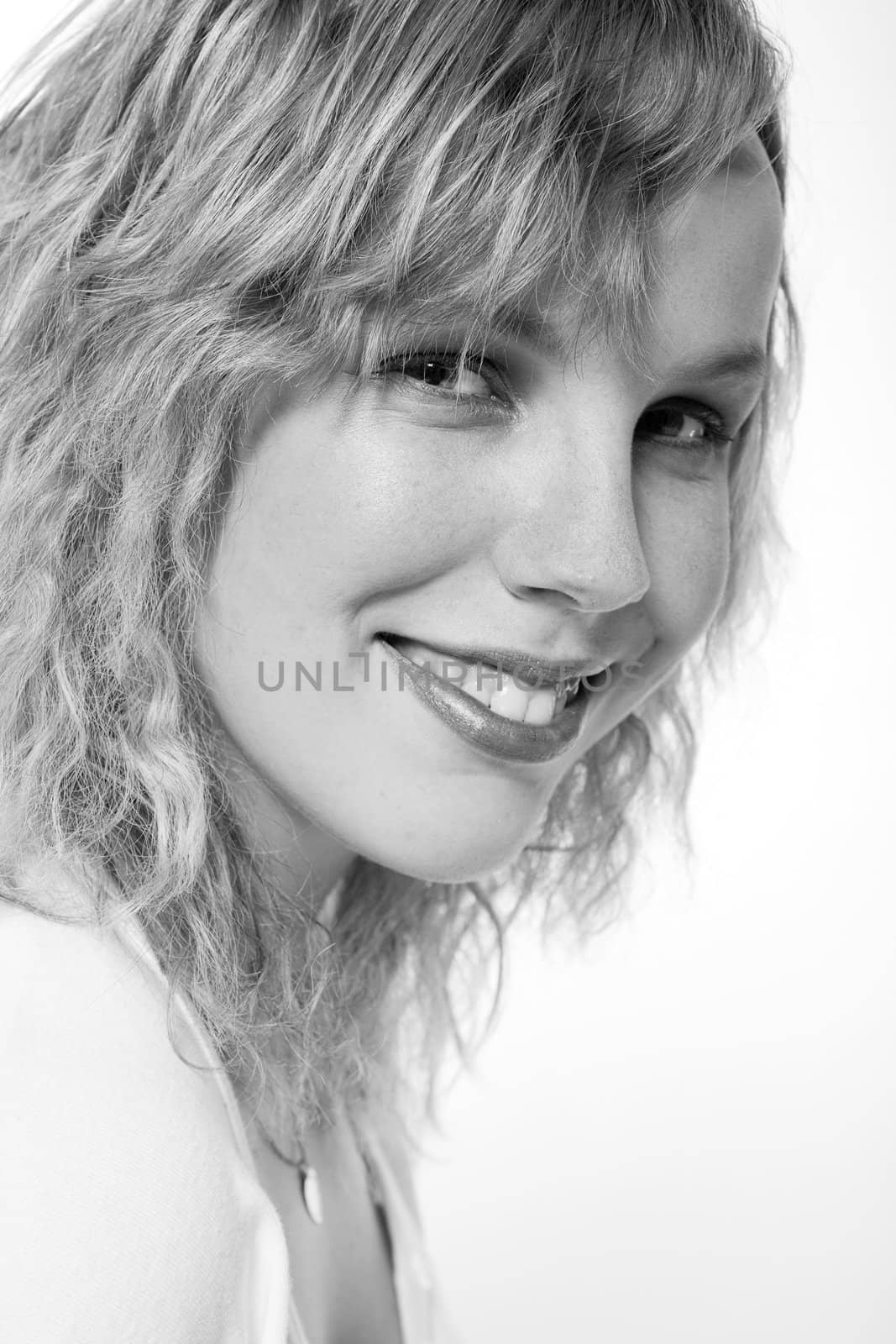 Studio portrait of a curly blond female