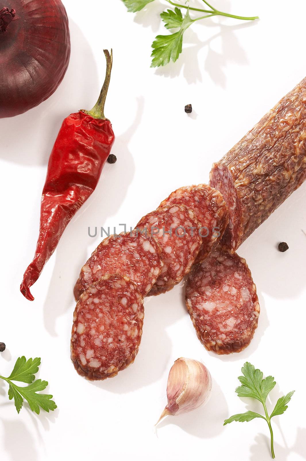 summer sausage and parsley with red paprika over white