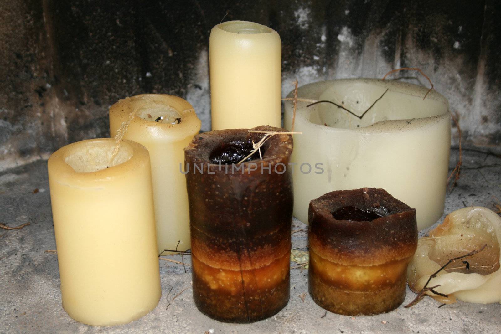 selection of candles in a fireplace