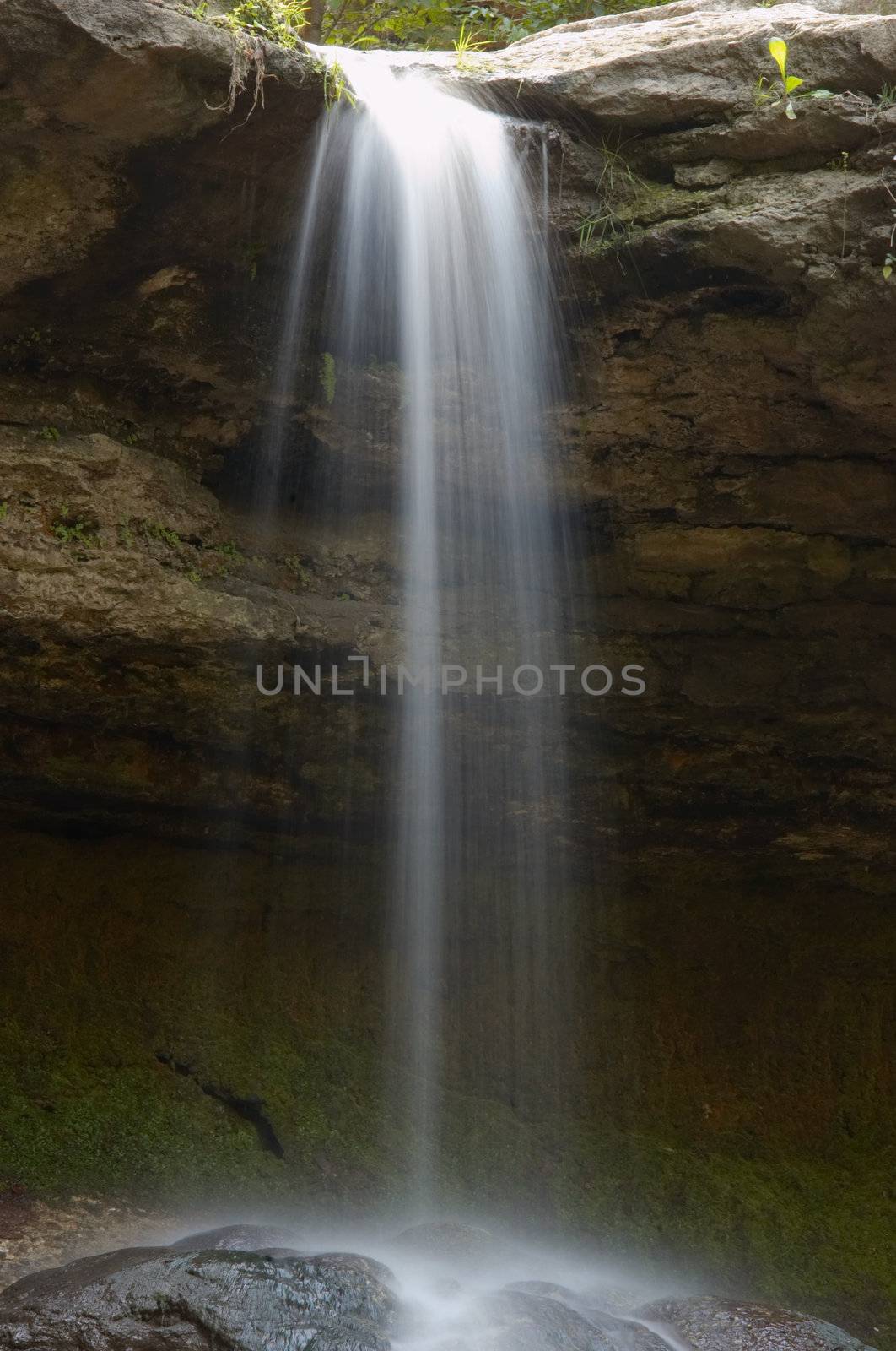 small waterfall in the forest. long exposure.