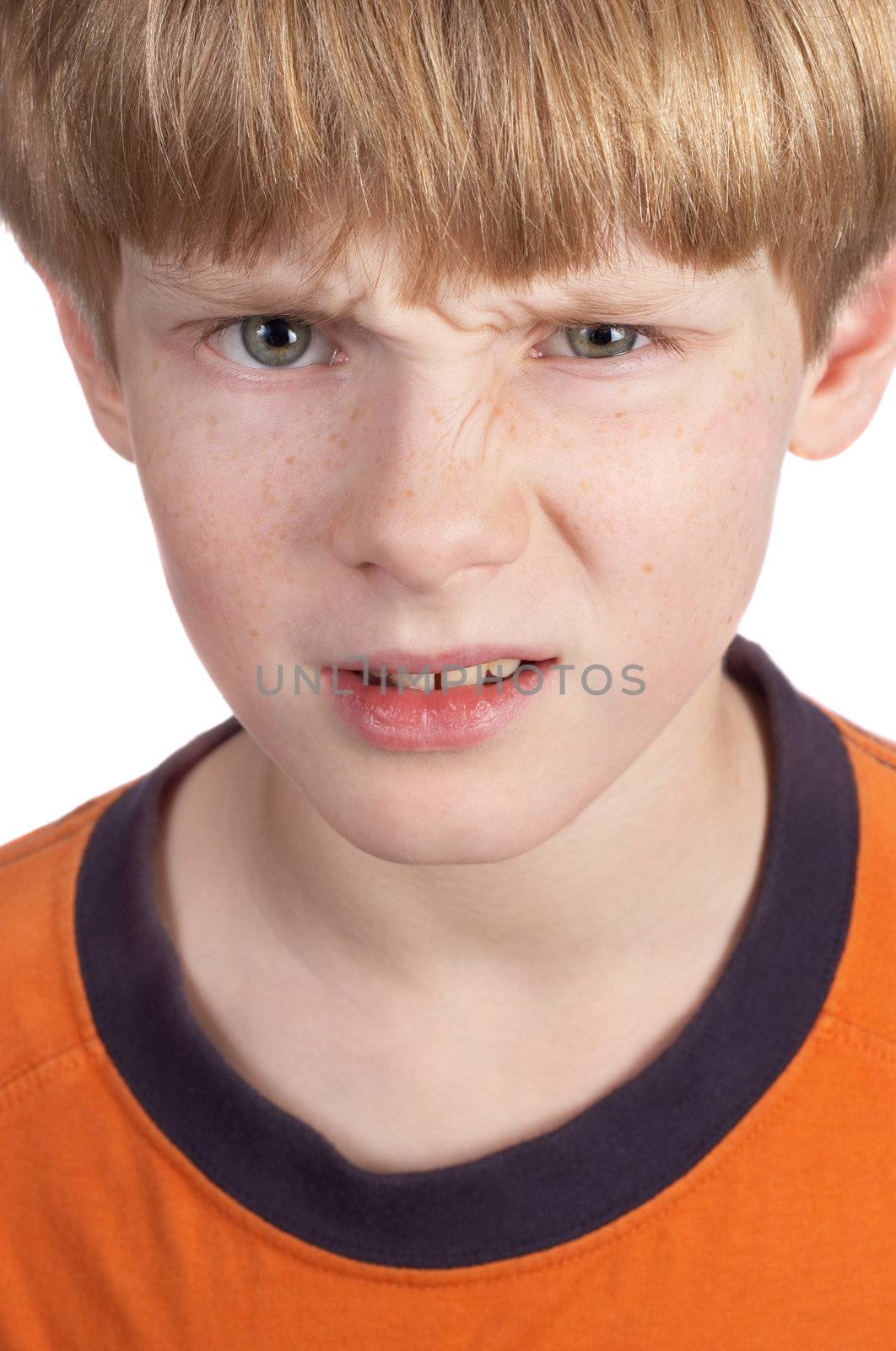 serious displeased blond boy, isolated on white