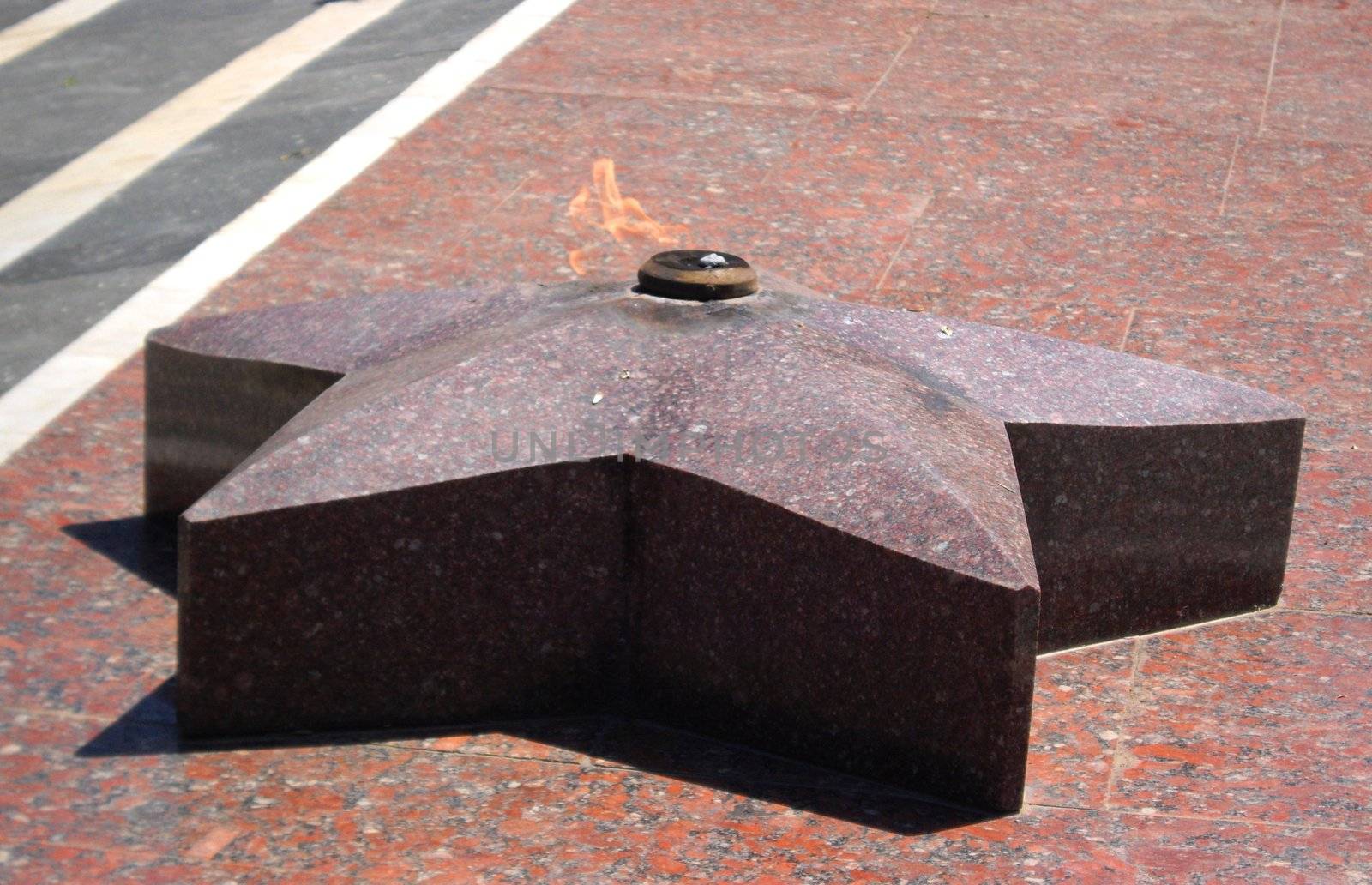 the eternal flame near the monument of soldiers of WWII