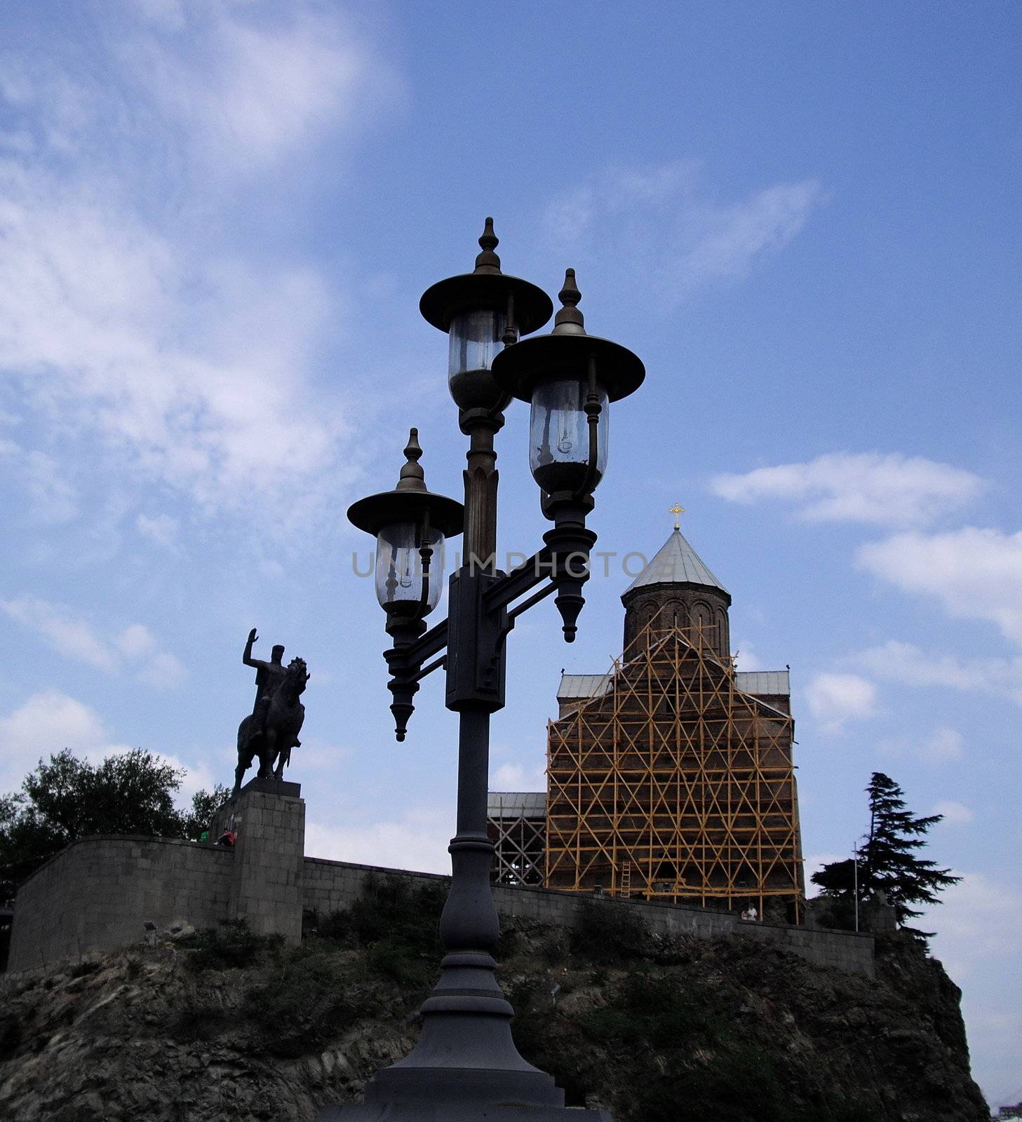 view from the bridge on the Mtikvari river to The Metexi church and the monument to King Vahtang Gorgosali