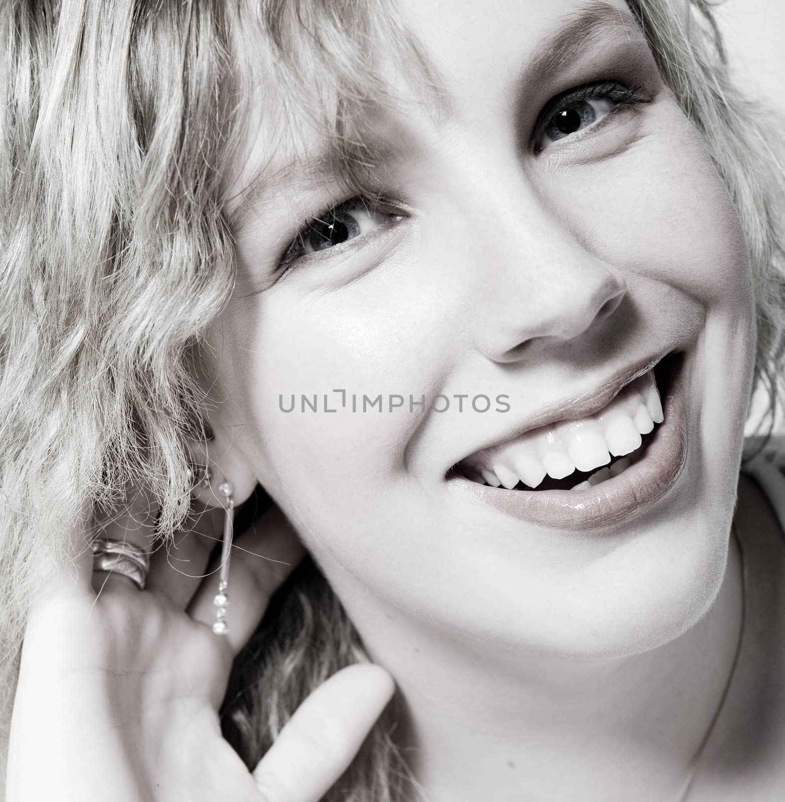 Studio portrait of a curly blond female