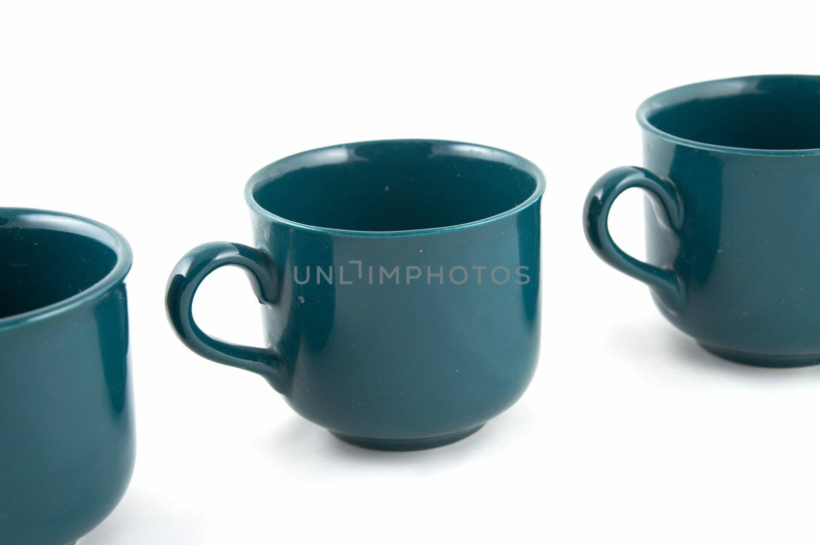 Green cups on a white background