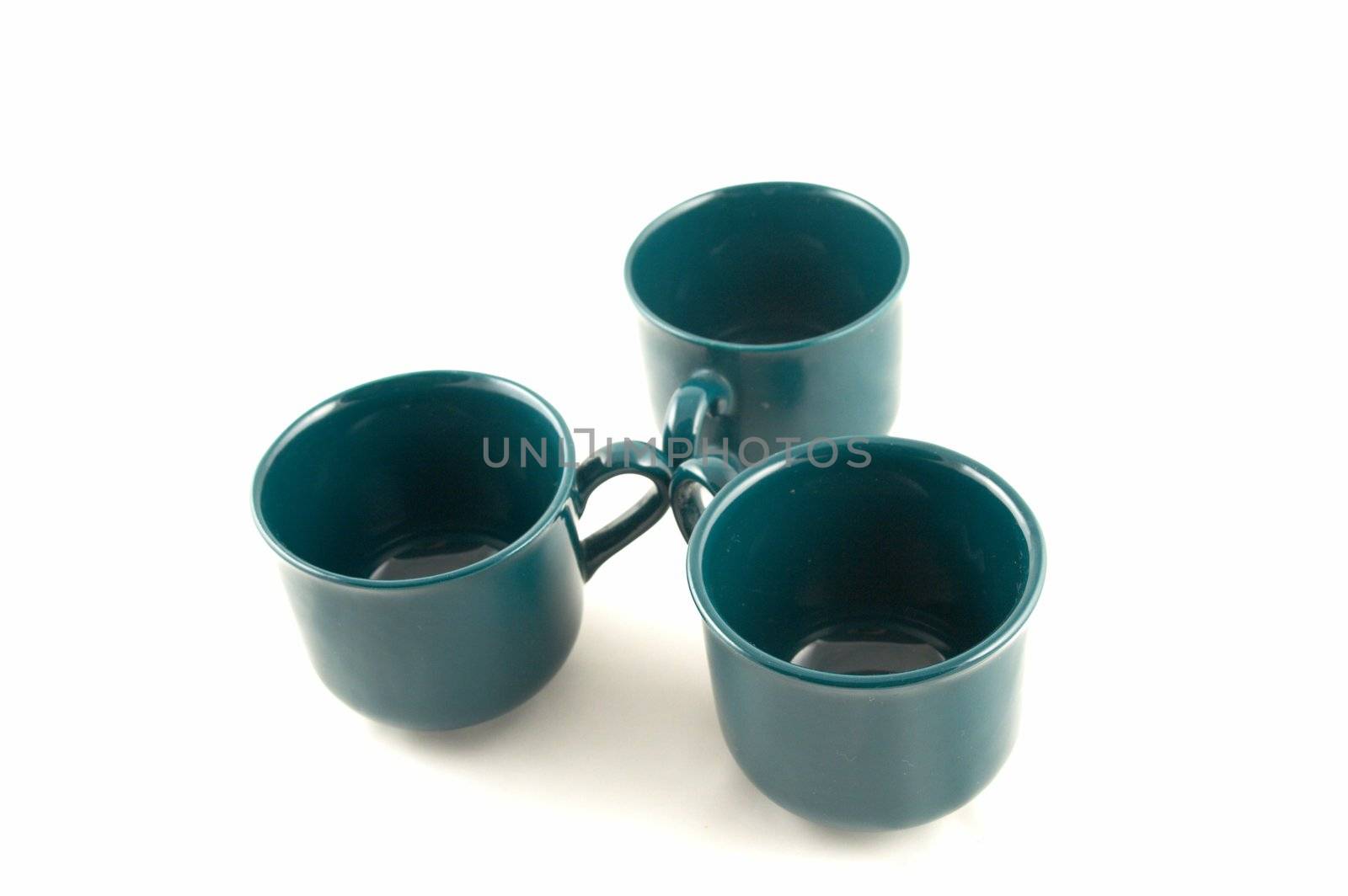 Green cups on a white background