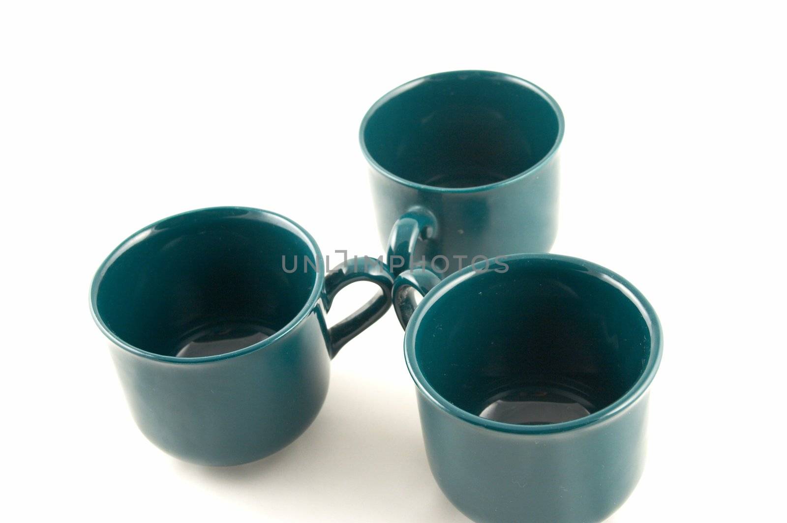 Green cups on a white background