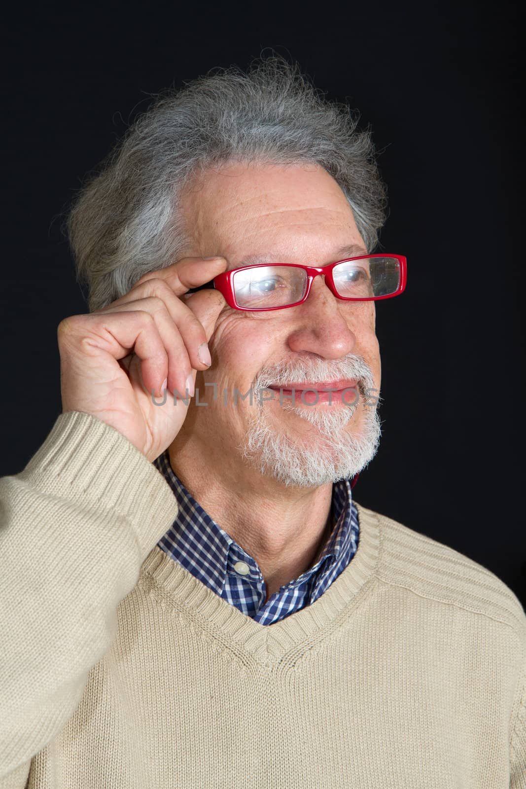 Portrait of a happy mature man isolated on black background 