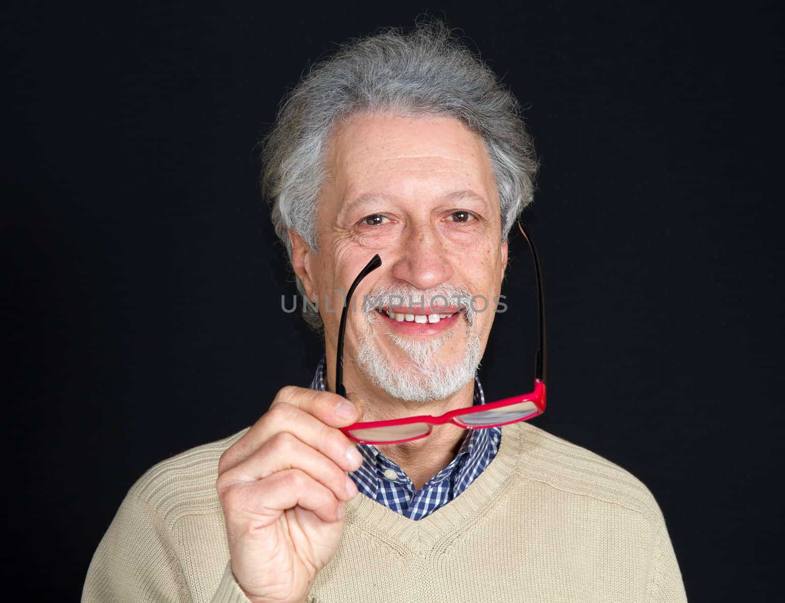 Portrait of a happy mature man isolated on black background 