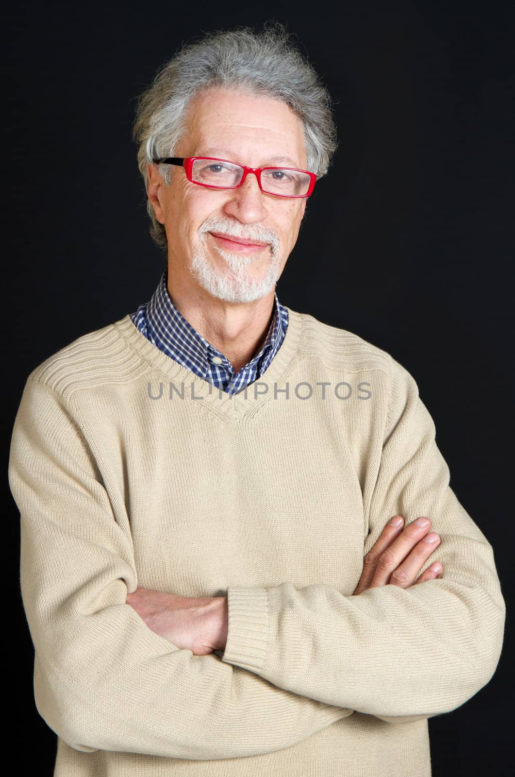 Portrait of a happy mature man isolated on black background 