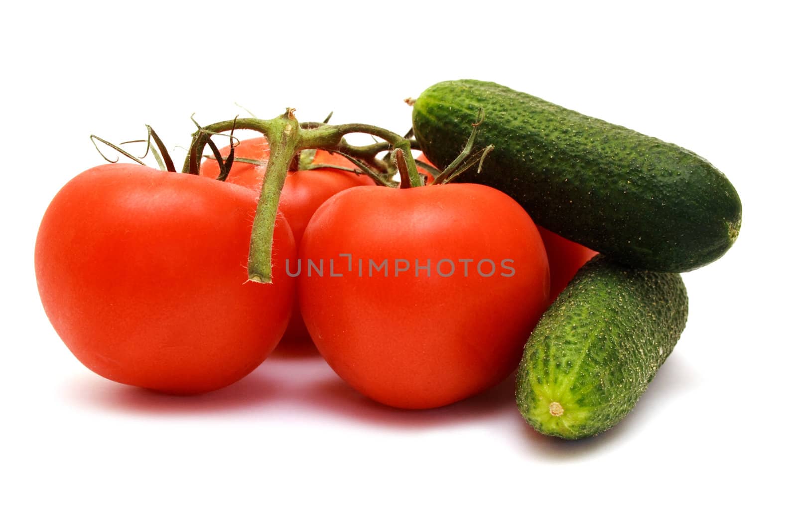 Foto of cucumbers  and tomatoes placed in room