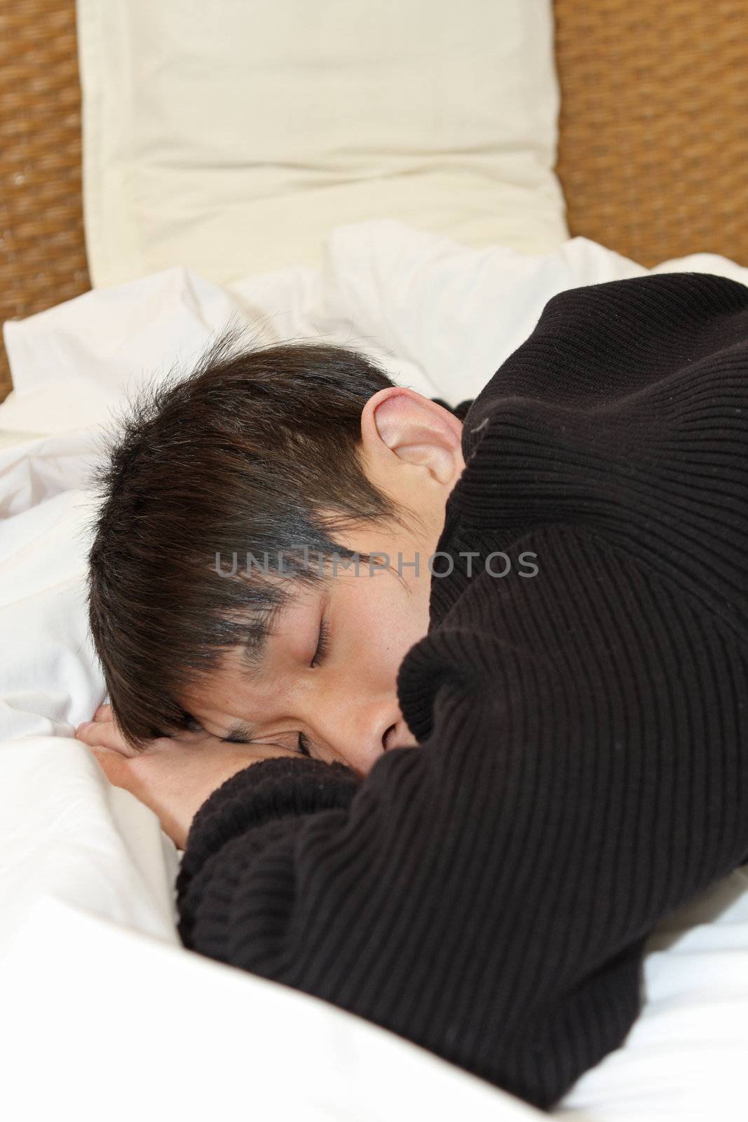 Man comfortably sleeping in his bed 