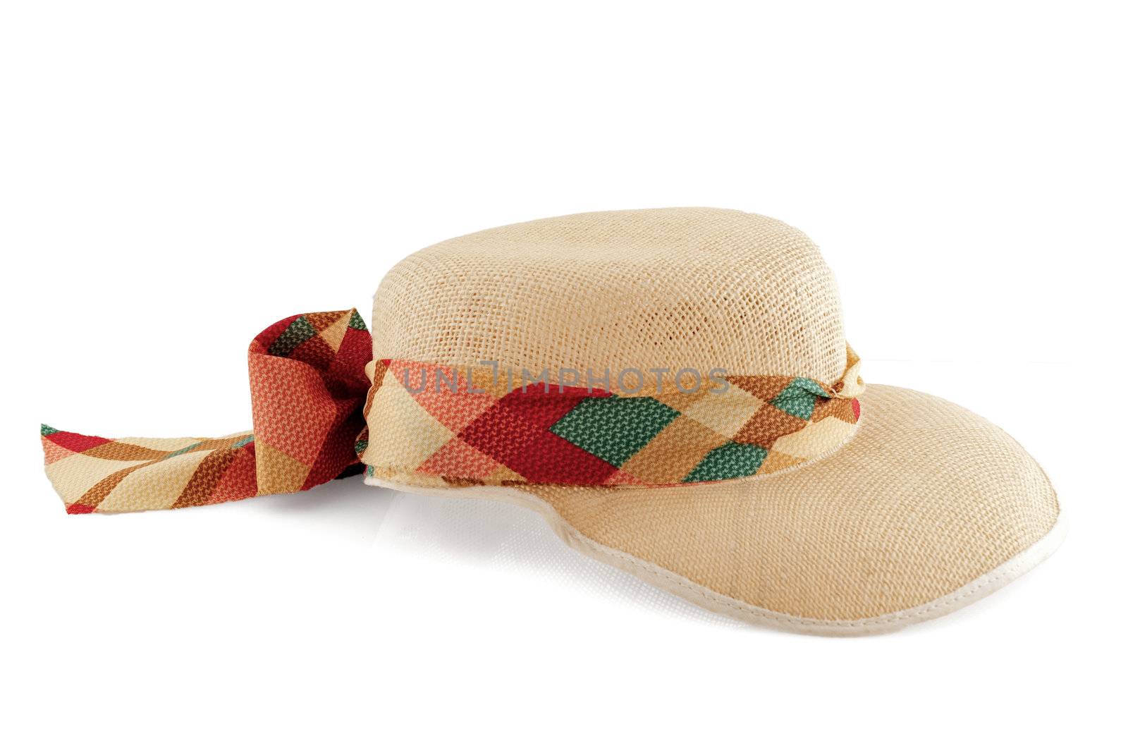 Straw hat with textile lace isolated on white background.