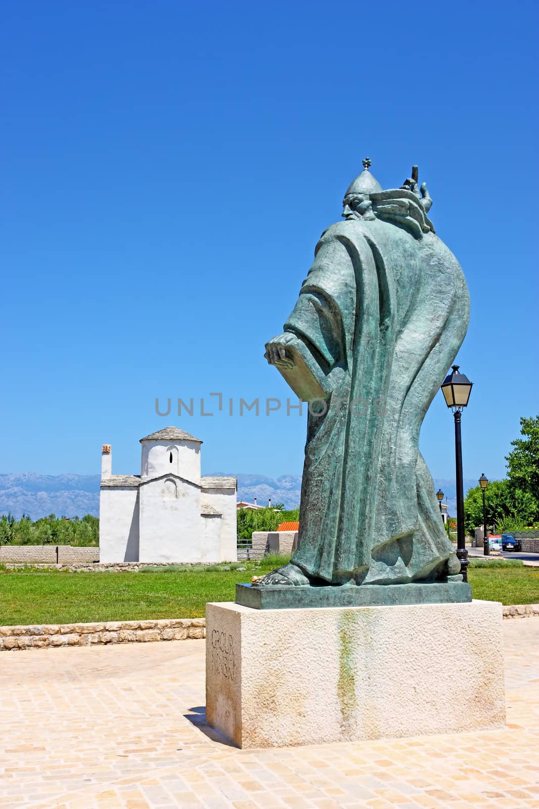 Church of the Holy Cross from 9th century and statue of bishop Gregory from Nin