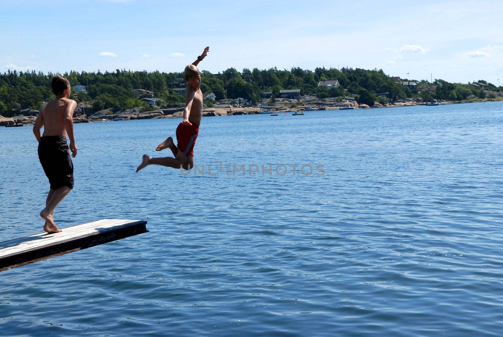 Scandinavian Lifestyle - jumping into the sea by Bildehagen