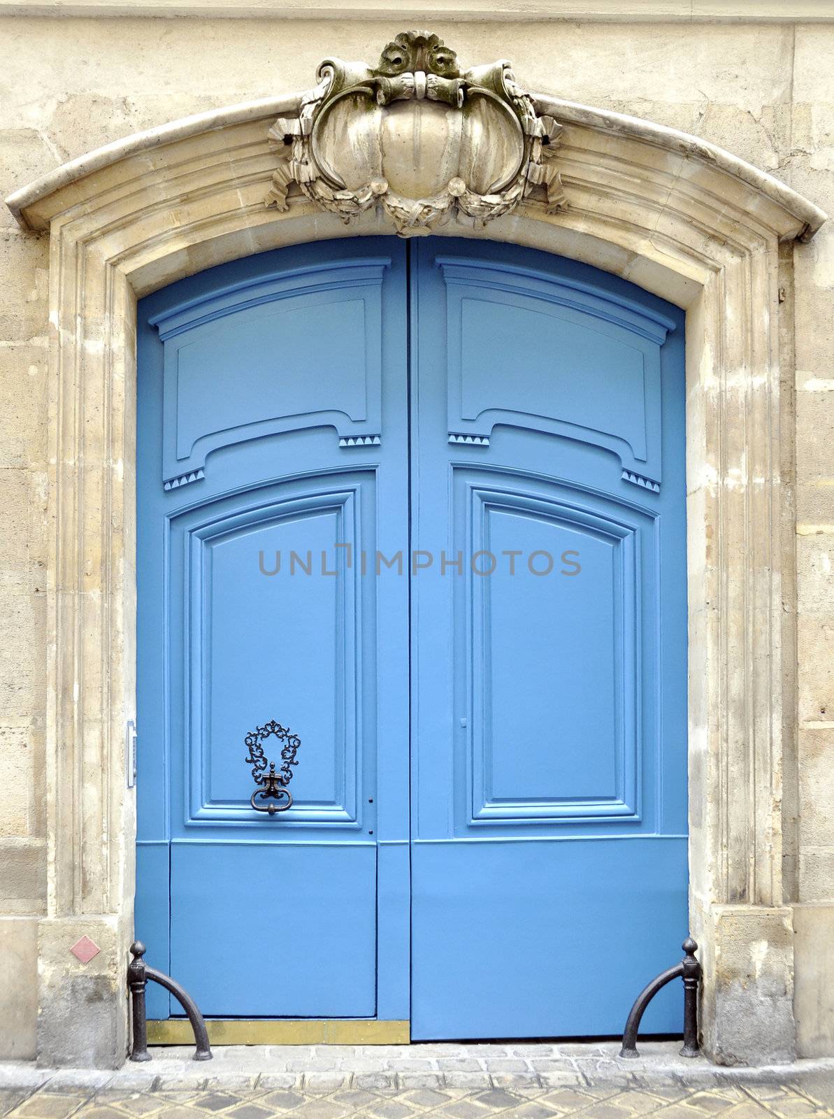 A blue door in Paris by dutourdumonde