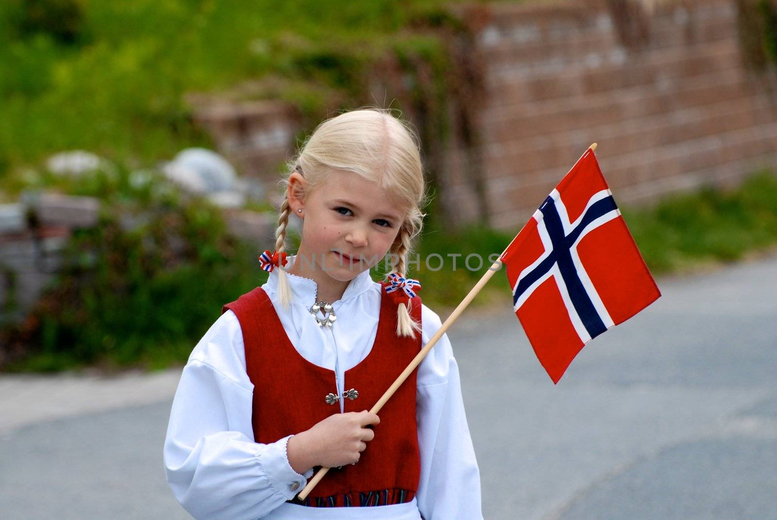 a little girl with national flag of Norway. Please note: No negative use allowed.