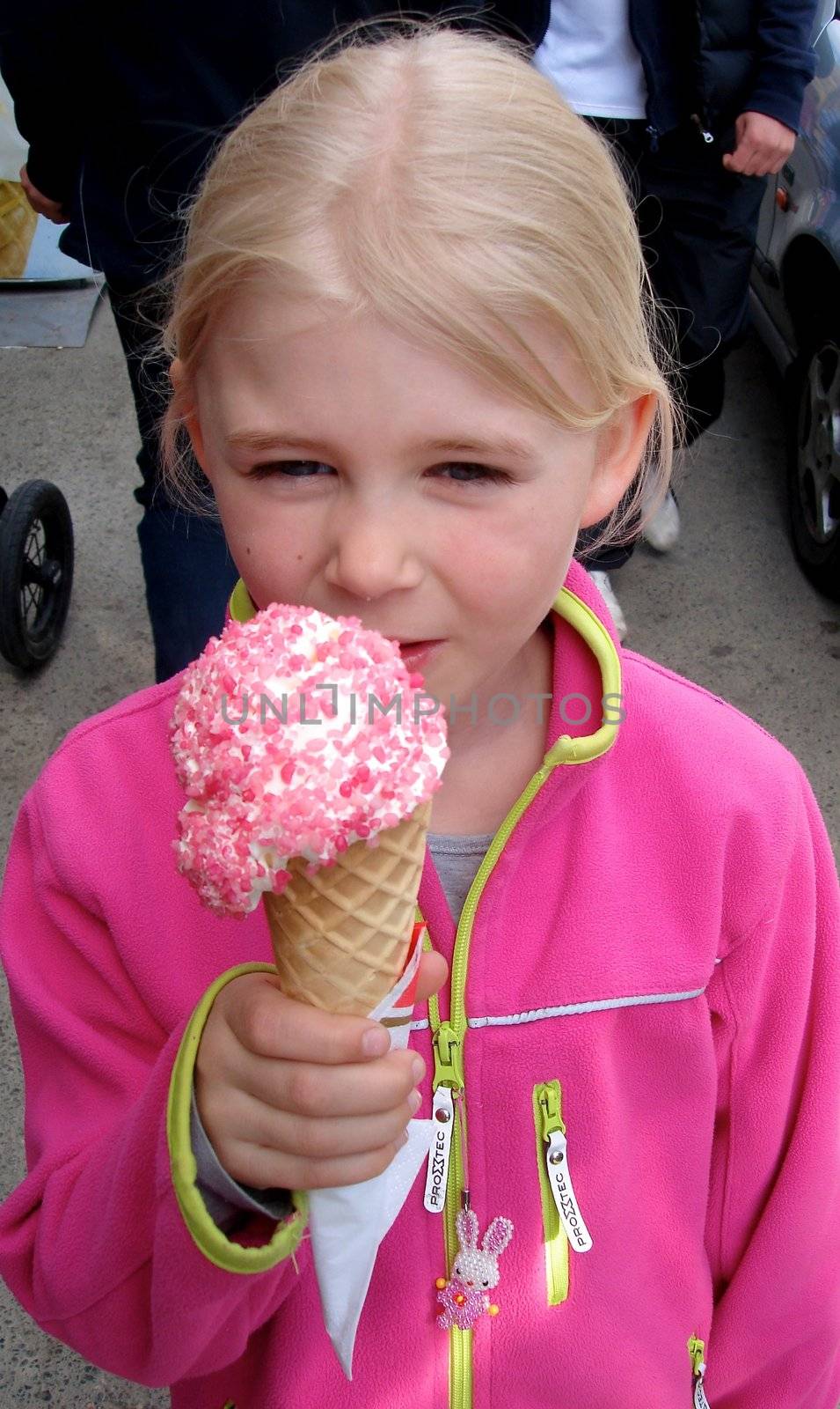 a girl is eating the ice cream. Please note: No negative use allowed.