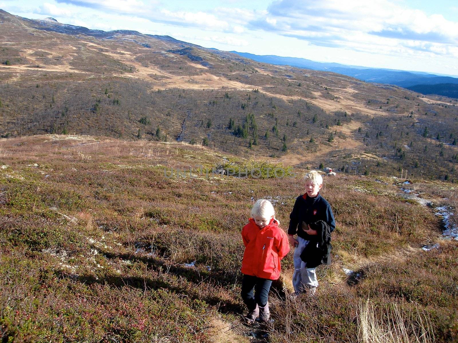 Scandinavian Lifestyle - children hiking on the mountain by Bildehagen