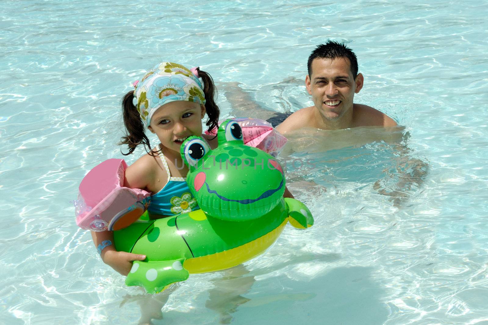 Happy man and child swimming