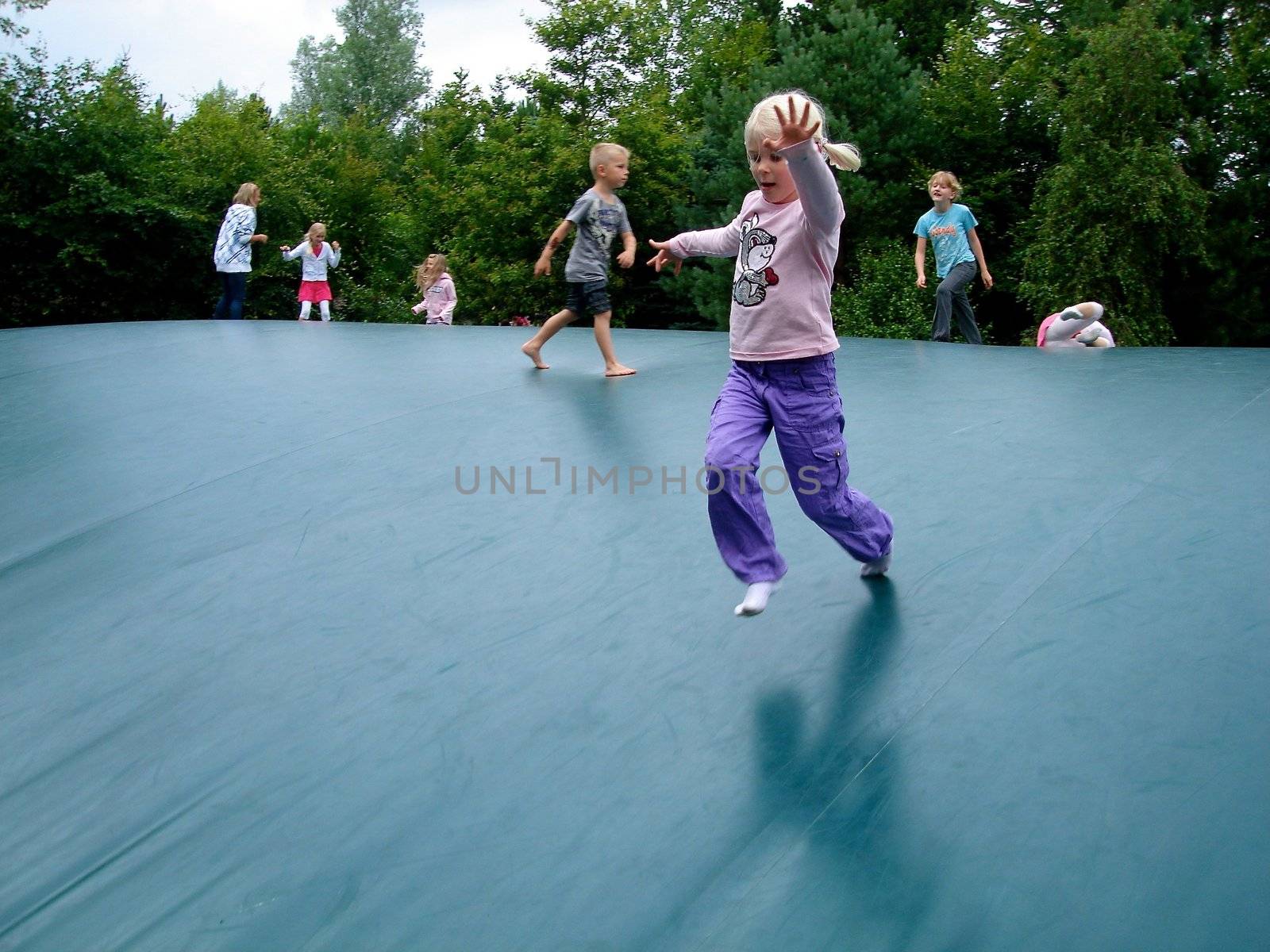 children playing on the trampoline. Please note: No negative use allowed.