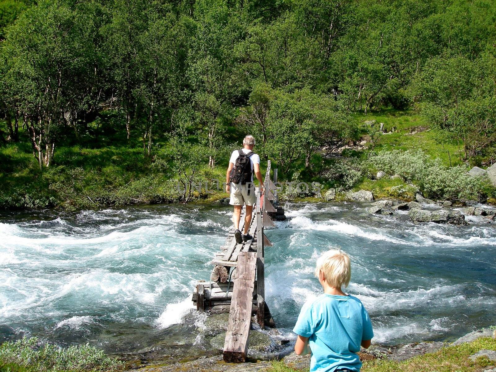 Scandinavian Lifestyle - walking on the wooden bridge by Bildehagen