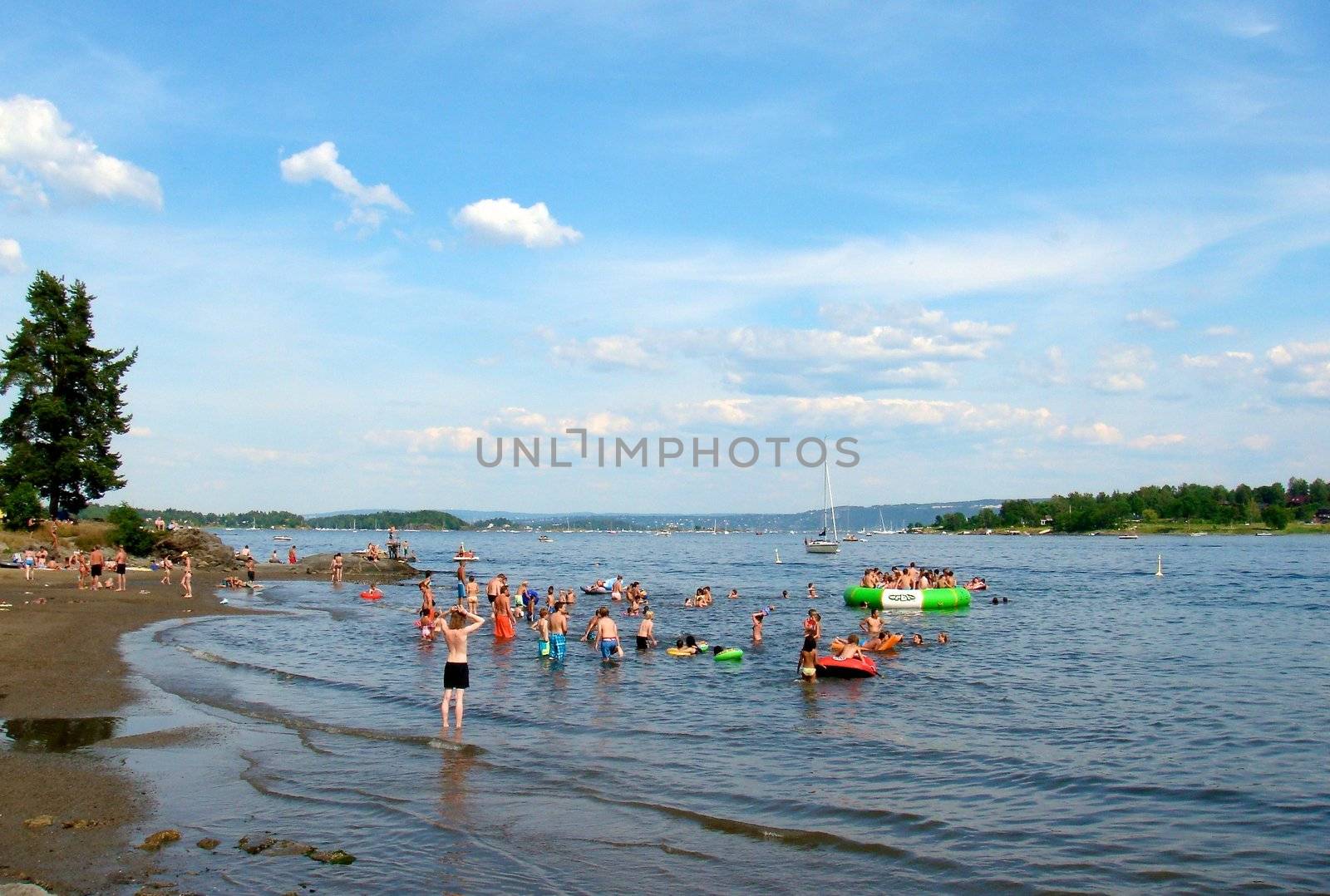 children having fun in the sea. Please note: No negative use allowed.