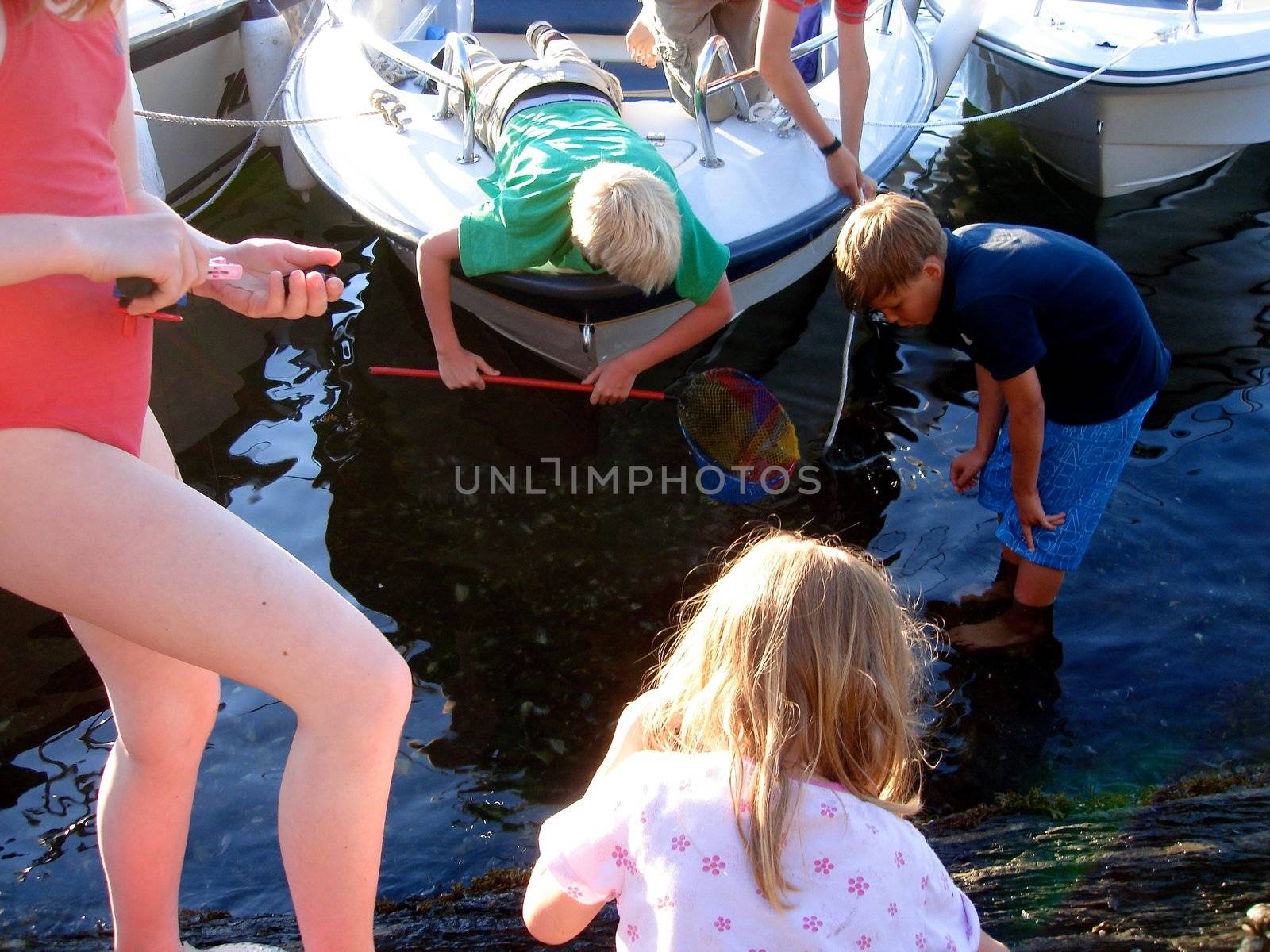 children having fun at the seaside. Please note: No negative use allowed.