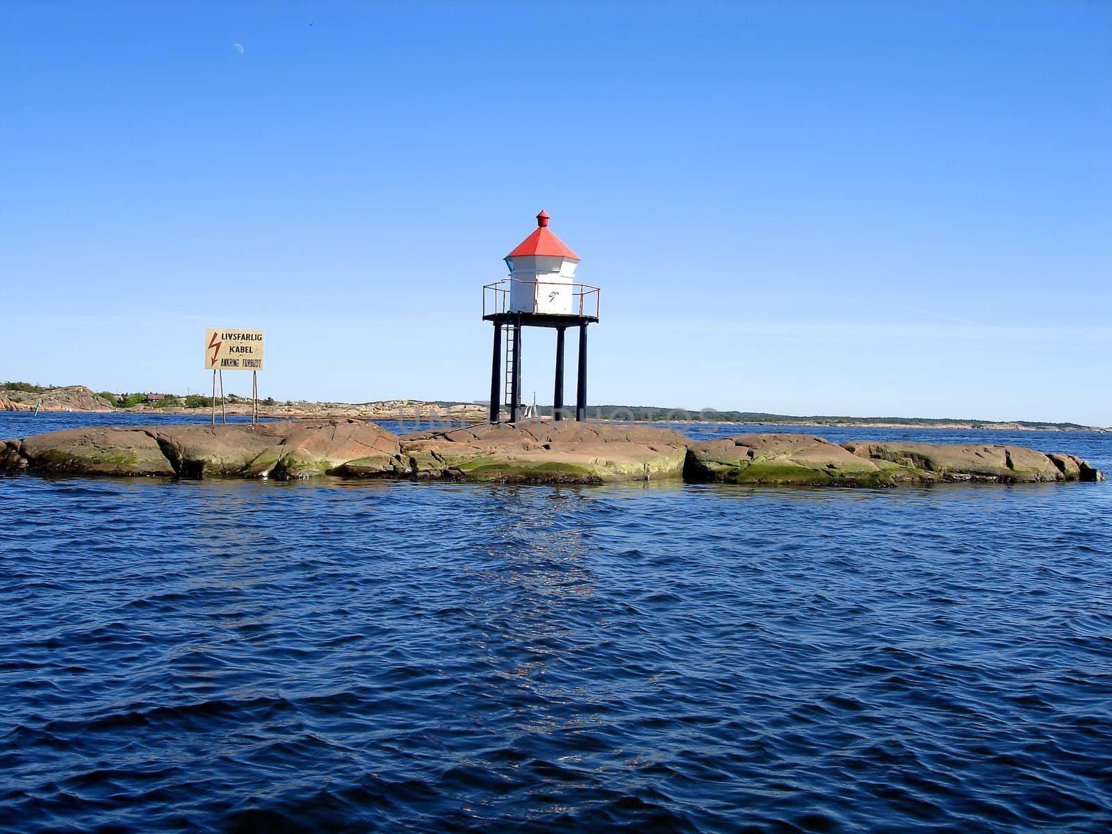 light house at the seaside. Please note: No negative use allowed.