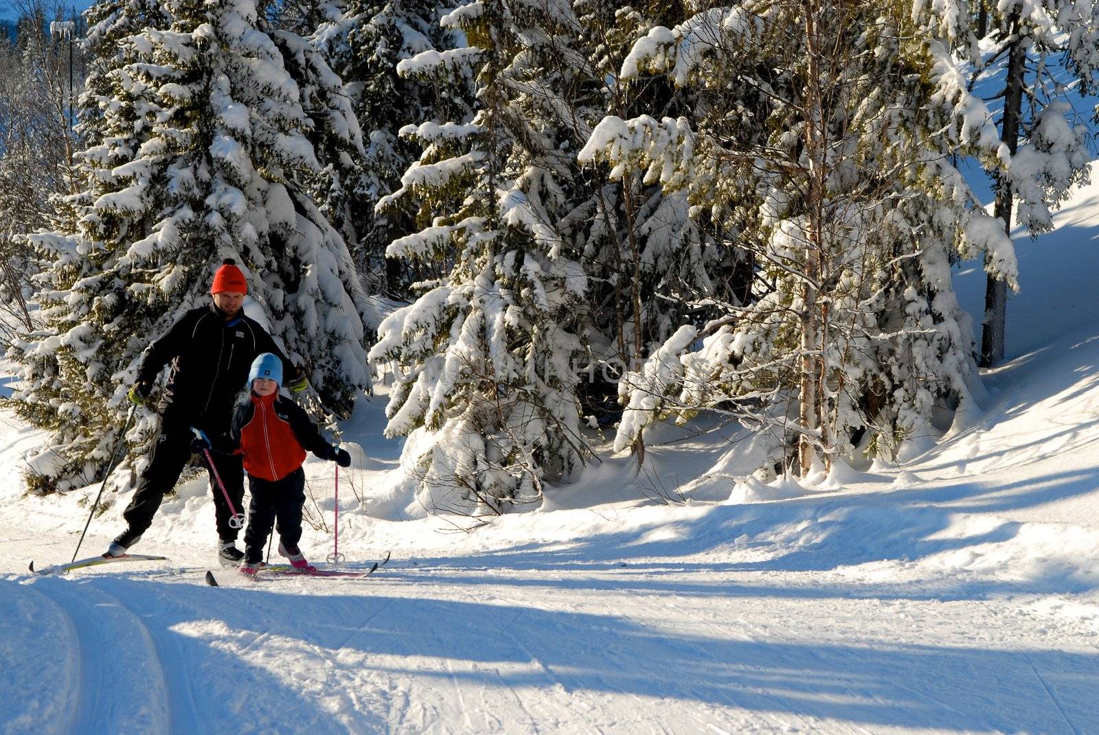 girl skiing with father. Please note: No negative use allowed.