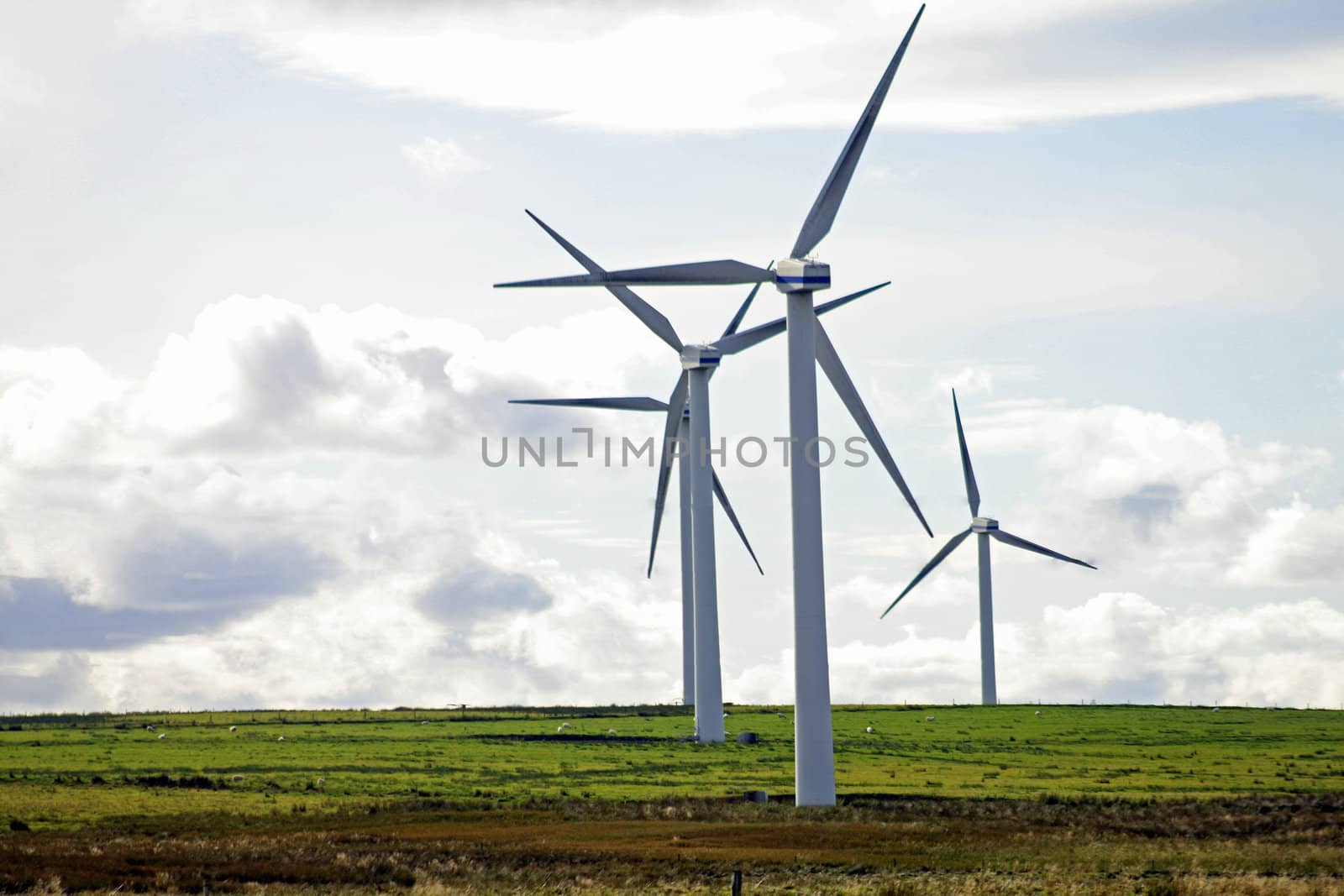 Typical windmill in a field creating aeolian energy