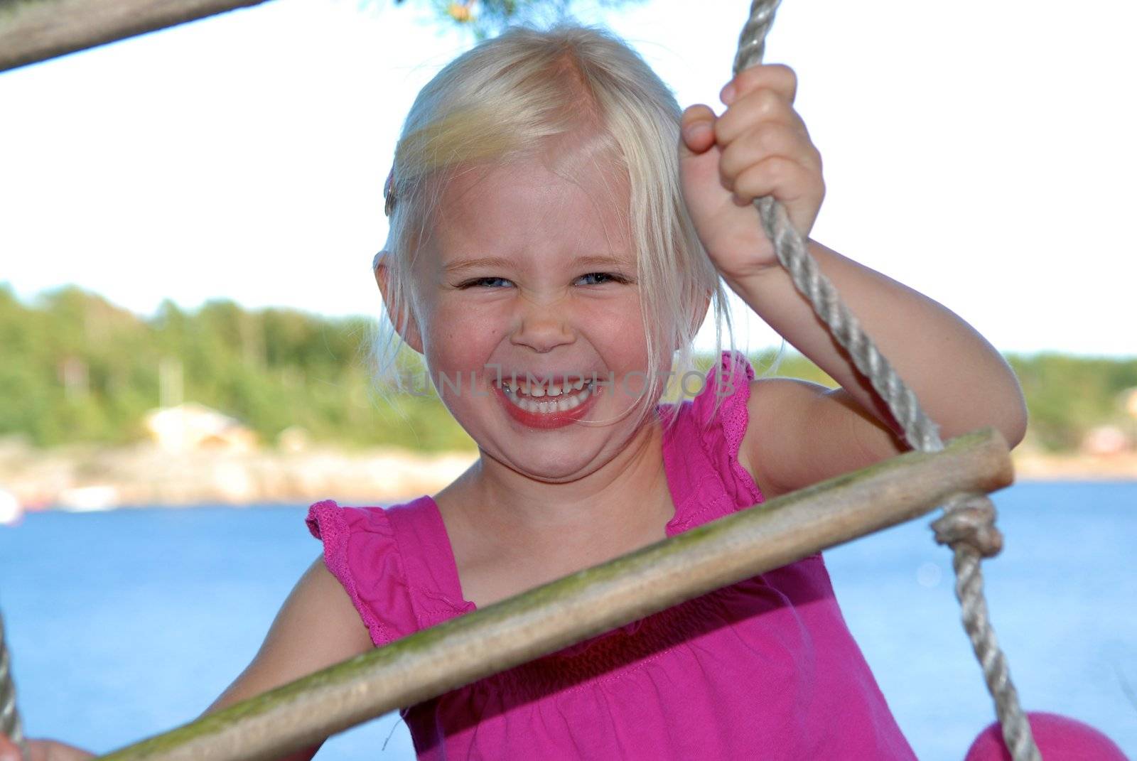 Scandinavian Lifestyle - little girl climbing the ladder by Bildehagen