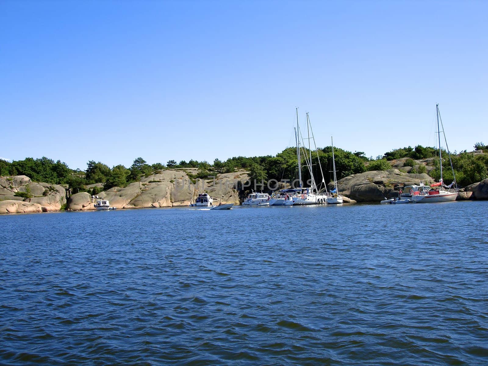 Scandinavian Lifestyle - boats berthing at the seaside by Bildehagen