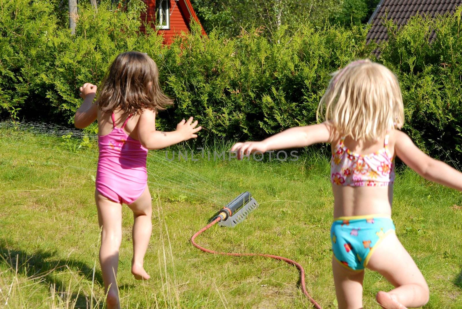 happy girl running in the garden. Please note: No negative use allowed.