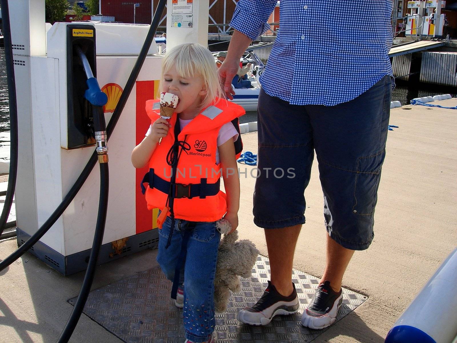 little girl eating ice cream. Please note: No negative use allowed.