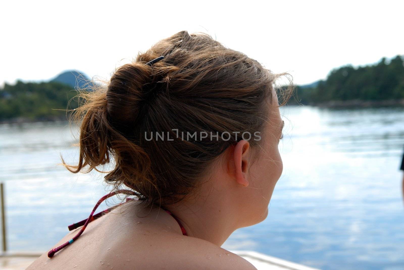 Scandinavian Lifestyle - woman looking over the sea by Bildehagen