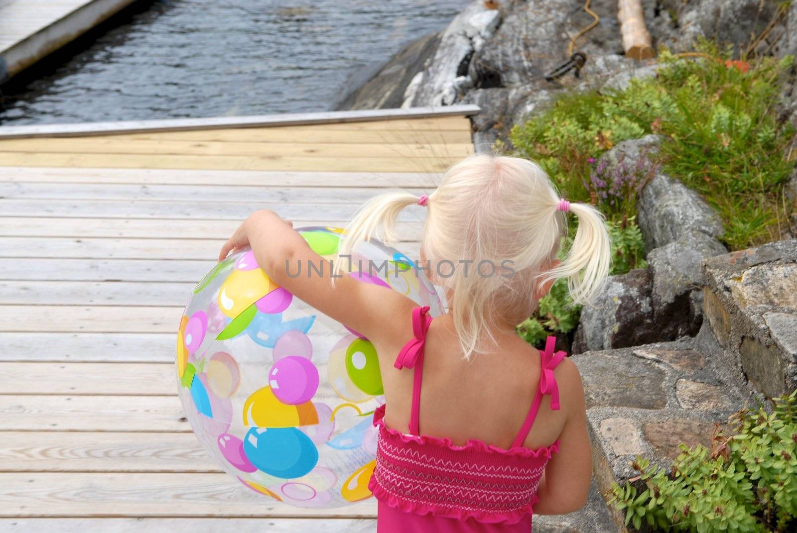 girl holding a balloon. Please note: No negative use allowed.