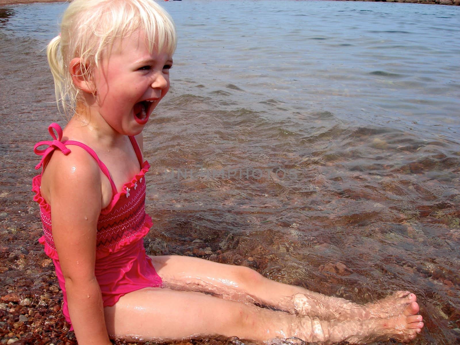 Scandinavian Lifestyle - children having fun at the seaside by Bildehagen