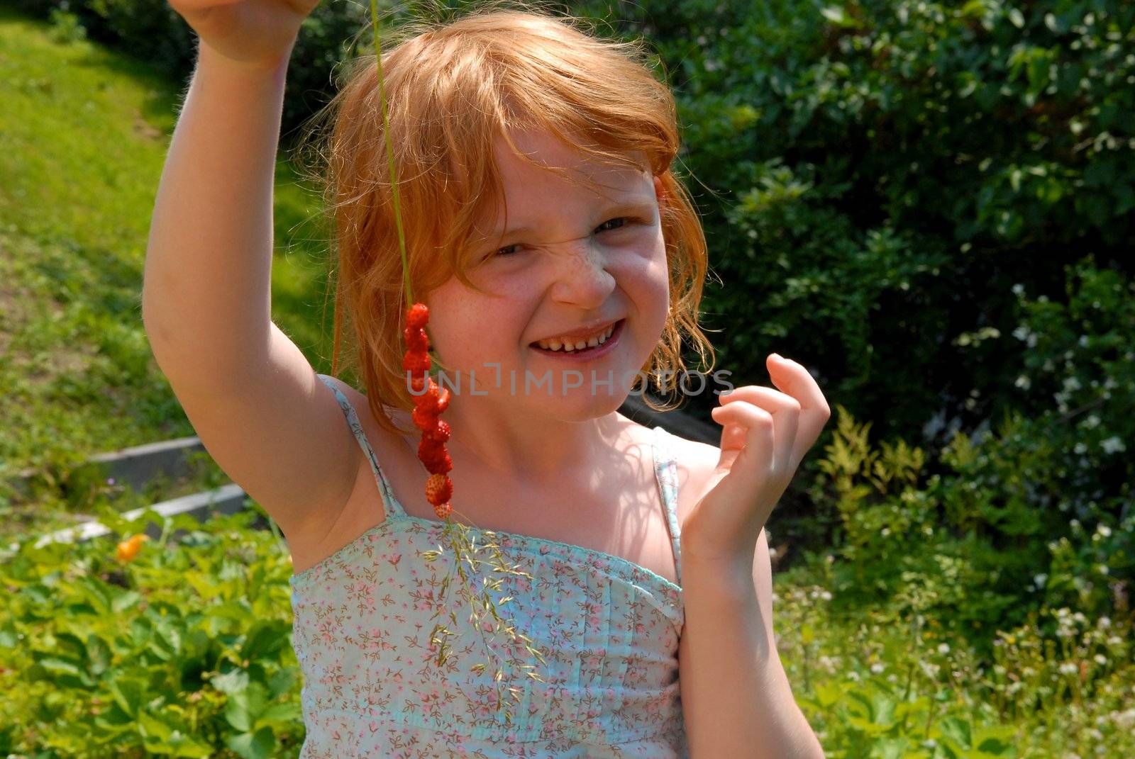 girl making the strawberry string. Please note: No negative use allowed.