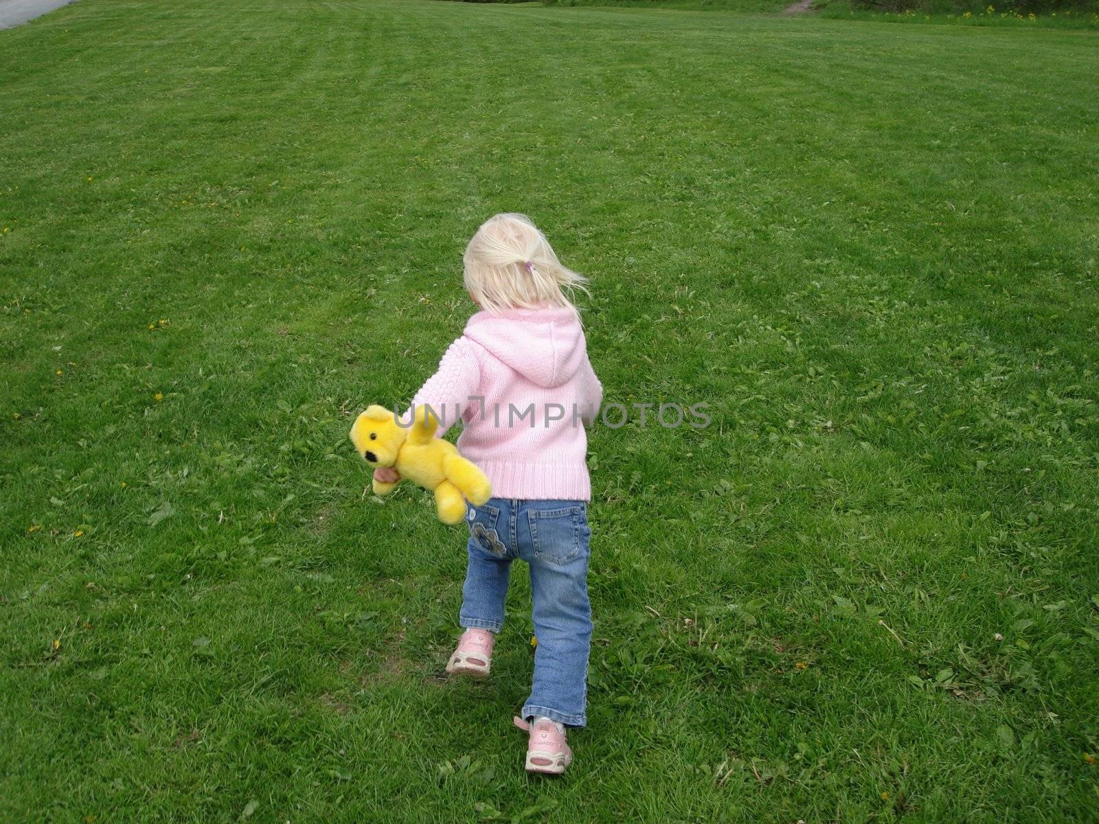 girl running in the garden. Please note: No negative use allowed.