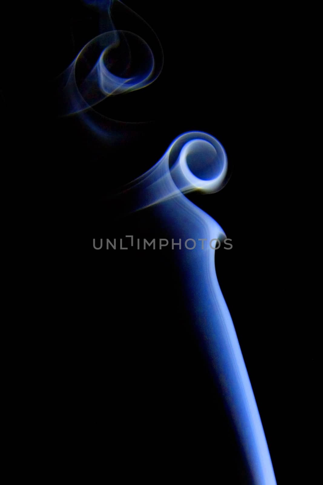 Abstract colored smoke isolated on black background